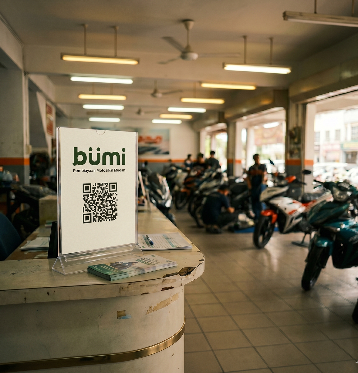Bümi-branded QR card on a counter at a Malaysian motorcycle dealership
